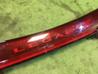 แผงตกแต่งระหว่างไฟท้าย SUBARU LEGACY OEM 84251AE000 BH5 1998