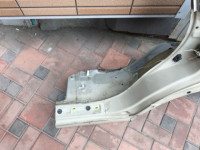 Guarda-lamas traseiro esquerdo SUBARU LANCASTER OEM 51410AE170 BHE BH9 1999 beige 8L5