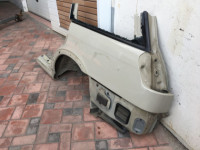 Guarda-lamas traseiro esquerdo SUBARU LANCASTER OEM 51410AE170 BHE BH9 1999 beige 8L5