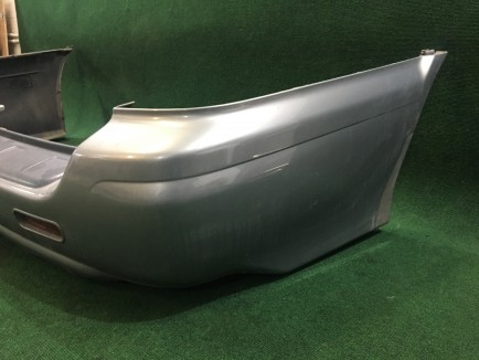 Para-choques traseiro SUBARU LANCASTER OEM 57703AE080LG XX57703AE080 BHE 2000 white / grey 0U4